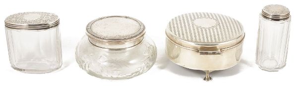 A collection of silver dressing tablewarecomprising a circular hinged lidded silver jewellery box,