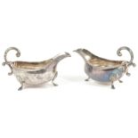 Two silver sauce boats, London 1966of typical form with rope edge, scrolled handle upon pad