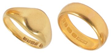 A 22ct gold wedding band marked for Sheffield, together with an 18ct gold signet ring (2)22ct band