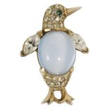 An amusing silver gilt and paste set penguin brooch, circa 1950having faux moonstone 'jelly