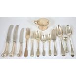 A selection of fiddle pattern and old English silver flatware, comprising six serving spoons, London