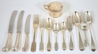 A selection of fiddle pattern and old English silver flatware, comprising six serving spoons, London