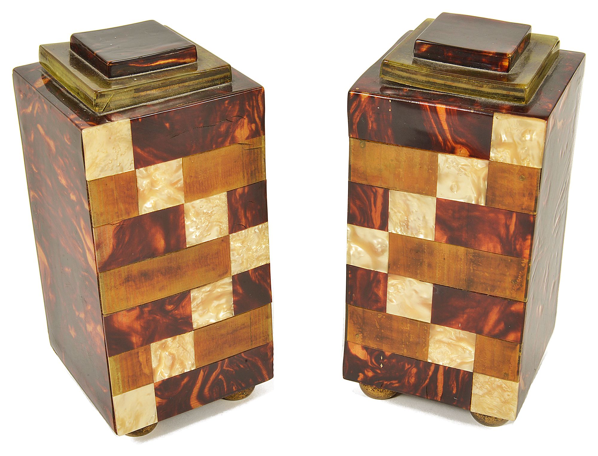 A pair of faux tortoiseshell veneered garniture square section columns