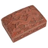 A Chinese rectangular carved cinnabar lacquer dragon box and cover, 20th centurythe lid carved