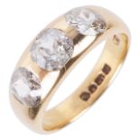 A gentleman's 18ct gold mounted three stone diamond set ring,