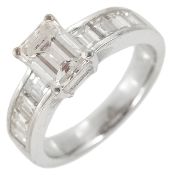 An attractive emerald cut diamond set ring