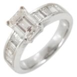 An attractive emerald cut diamond set ring