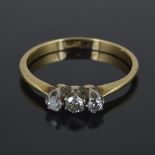 A delicate three stone diamond ring
