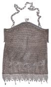 A silver chain mail bag