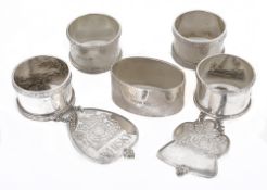 A collection silver napkin rings and decanter labels