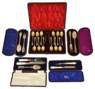 A collection of five cases of silver flat wear including teaspoons and christening sets