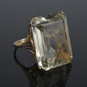 A very large pale lemon rectangular gem set dress ring, circa 1970