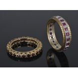 A square ruby set full eternity ring and a garnet set eternity ring