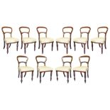 A suite of ten Victorian mahogany balloon back dining chairs