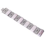 A Continental Art Deco filigree and rose quartz set panel bracelet