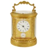 An oval four glass gilt metal repeater carriage clock, late 19th century