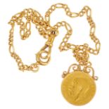 A George V fine gold sovereign with 18ct gold mount and chain