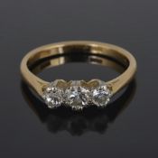 A three stone diamond set ring