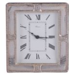 A modern clock with silver frame
