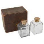 Two cased glass scent/cologne bottles