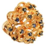A contemporary 9ct gold and sapphire set bombe ring