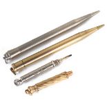 A collection of gold and silver retracting pencils