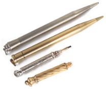 A collection of gold and silver retracting pencils
