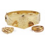 A four section gold puzzle ring,