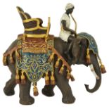 A large contemporary cold painted bronze figure of elephant and rider after Bergman