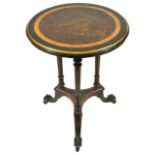 A Victorian ebonised circular side table