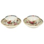 A pair of Chinese 18th century famille rose tea bowls and saucers