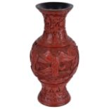 A small Chinese early 20th century red cinnabar lacquer vase
