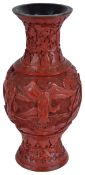 A small Chinese early 20th century red cinnabar lacquer vase