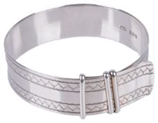 A mid 20th century silver 'strap' bangle