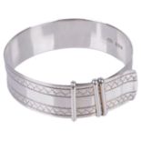 A mid 20th century silver 'strap' bangle