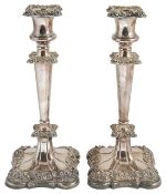 A pair of Wilson & Gill silver plated candlesticks,