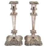 A pair of Wilson & Gill silver plated candlesticks,