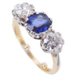 A three stone sapphire and diamond set ring