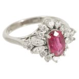 An attractive Continental ruby and diamond oval fancy cluster ring