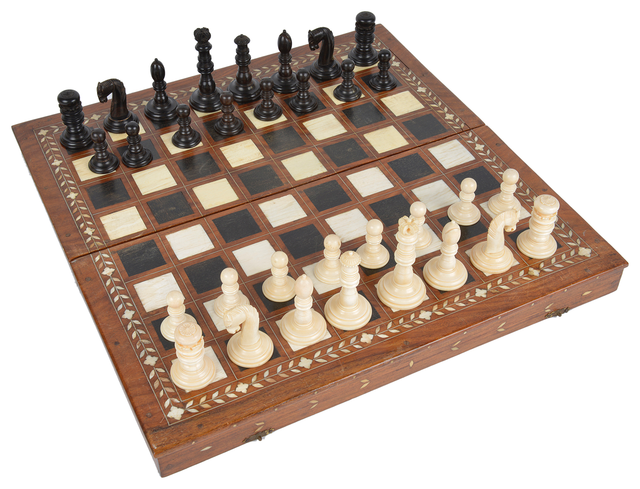 A late 19th/early 20th century coromandel and ivory chess set and later boardthe turned ivory and