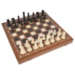 A late 19th/early 20th century coromandel and ivory chess set and later boardthe turned ivory and