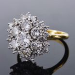 A large diamond set fancy cluster ring, circa 1970having central diamond of approx. 0.50ct,