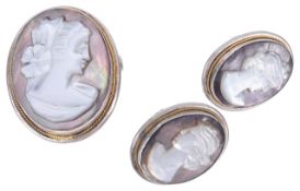 A silver mounted carved nacre cameo brooch and matching earringseach piece carved with a classical