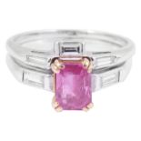 An unusual contemporary ruby and diamond two section ringthe main ring set with an emerald cut