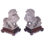 A pair of Chinese carved stone figures of temple guardians, possibly early 19th Century and having