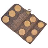 A coin wallet containing three full fine gold sovereigns and six half sovereignscomprising three