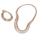 An attractive 9ct gold Egyptian style fringe necklace with foliate detailmarked for 9ct gold,