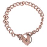 A rose gold curb link bracelet with heart padlock fasteningeach link stamped 9ctapprox. weight 10.