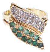 An unusual Continental emerald and diamond set ring of twin leaf formone leaf diamond set the