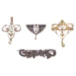 An Arts & Crafts pierced enamelled scroll brooch and two Art Nouveau pendantsthe former set with a